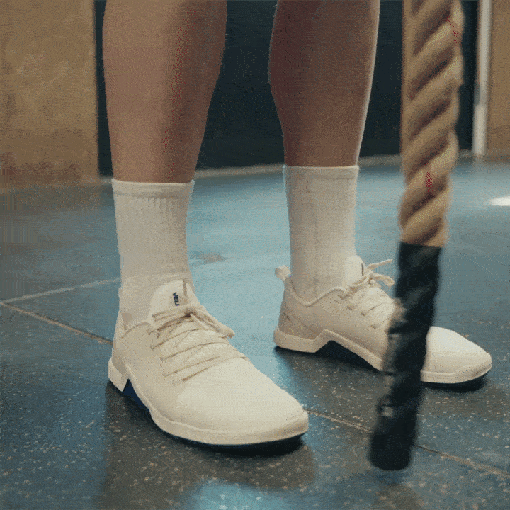 GIF of Minimal 1.0 Velites Ivory White barefoot shoe with purple side protection diagram for rope climb