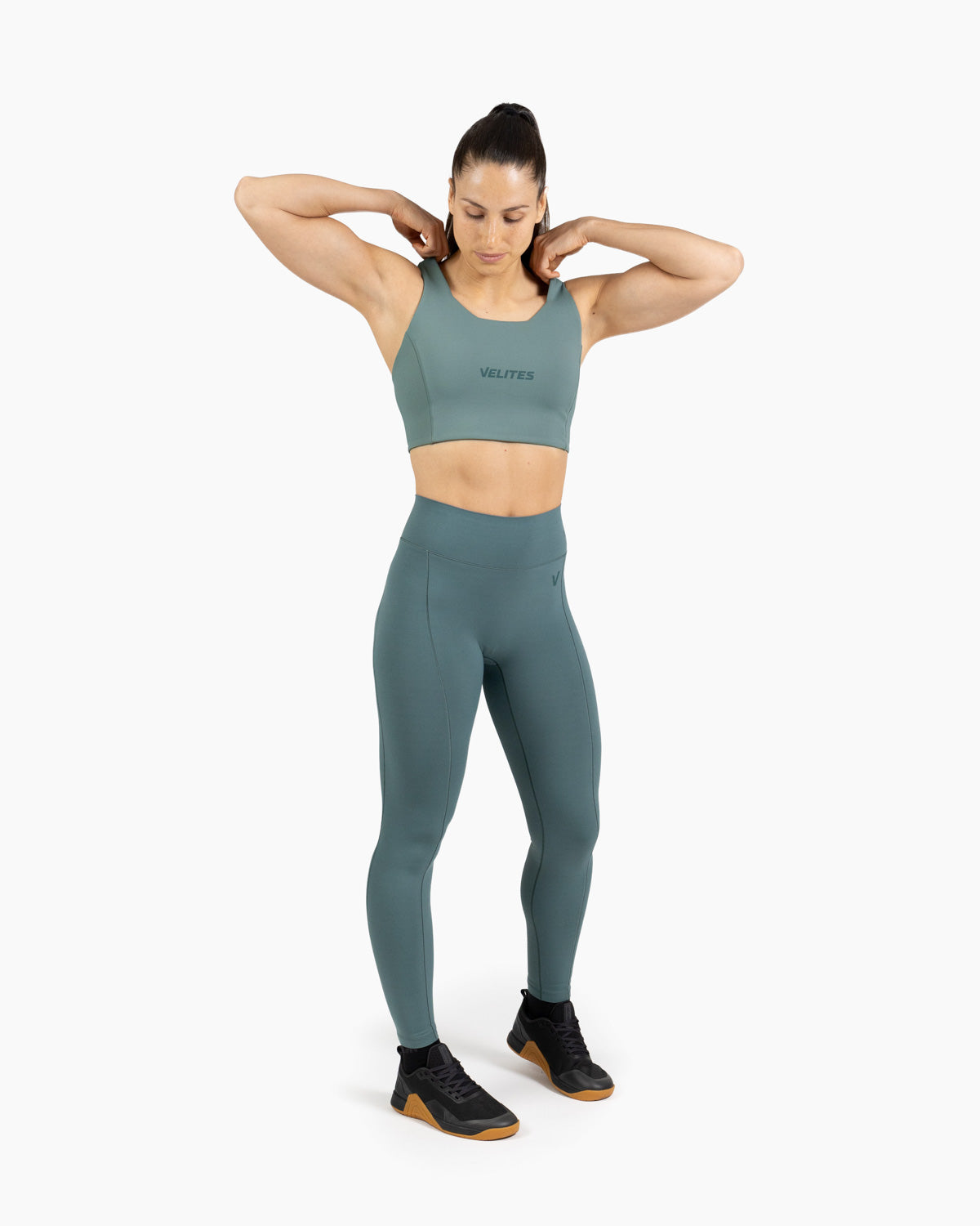 High neck bra Holo Velites female model exercising color_Pine green